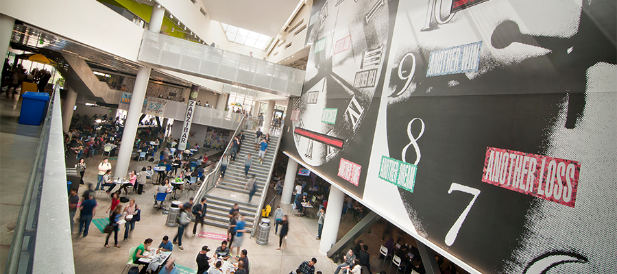 Bustling interior of Price Center East, part of University Centers, on campus at UC San Diego